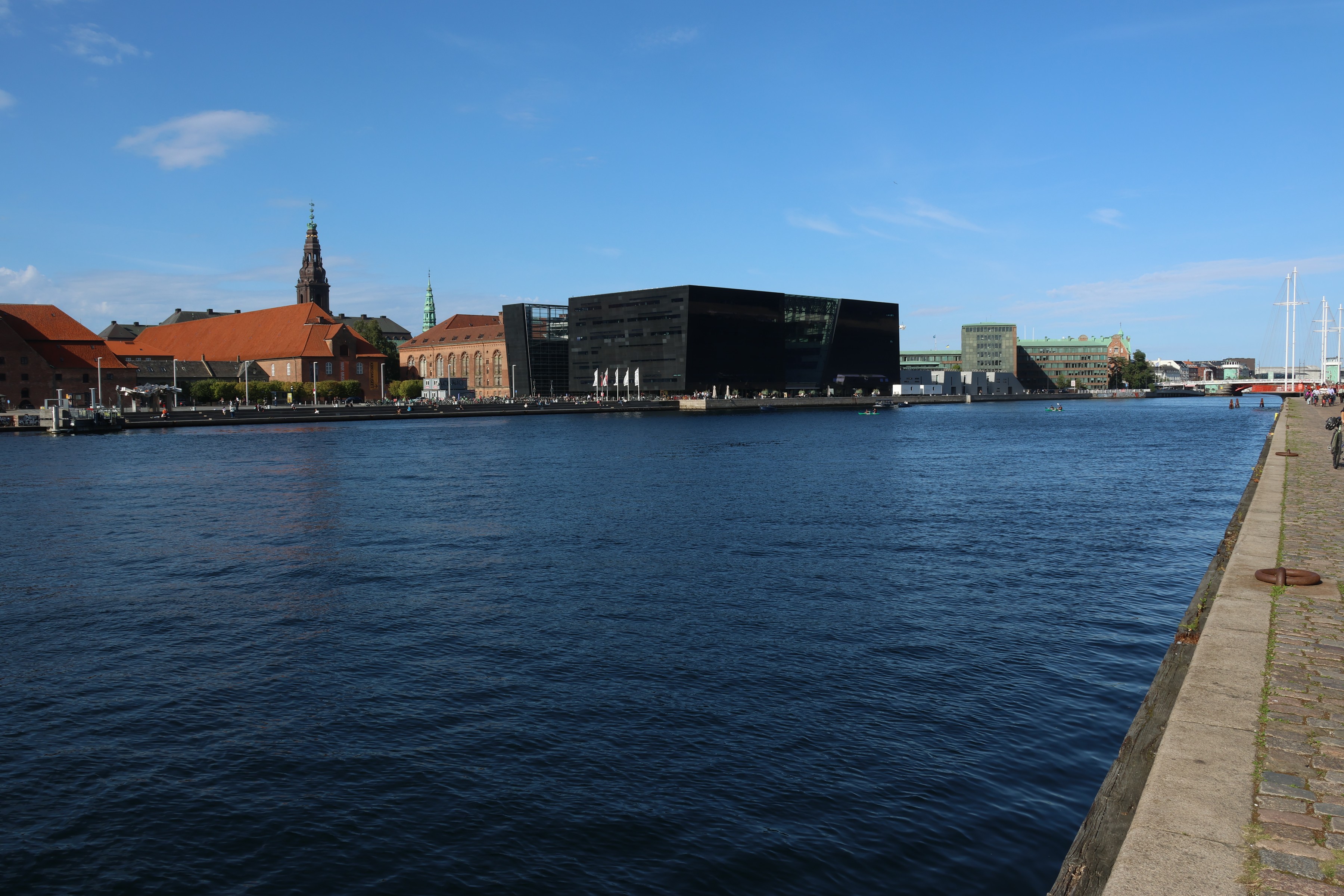 The dark glass wedge of the Black Diamond library across the water