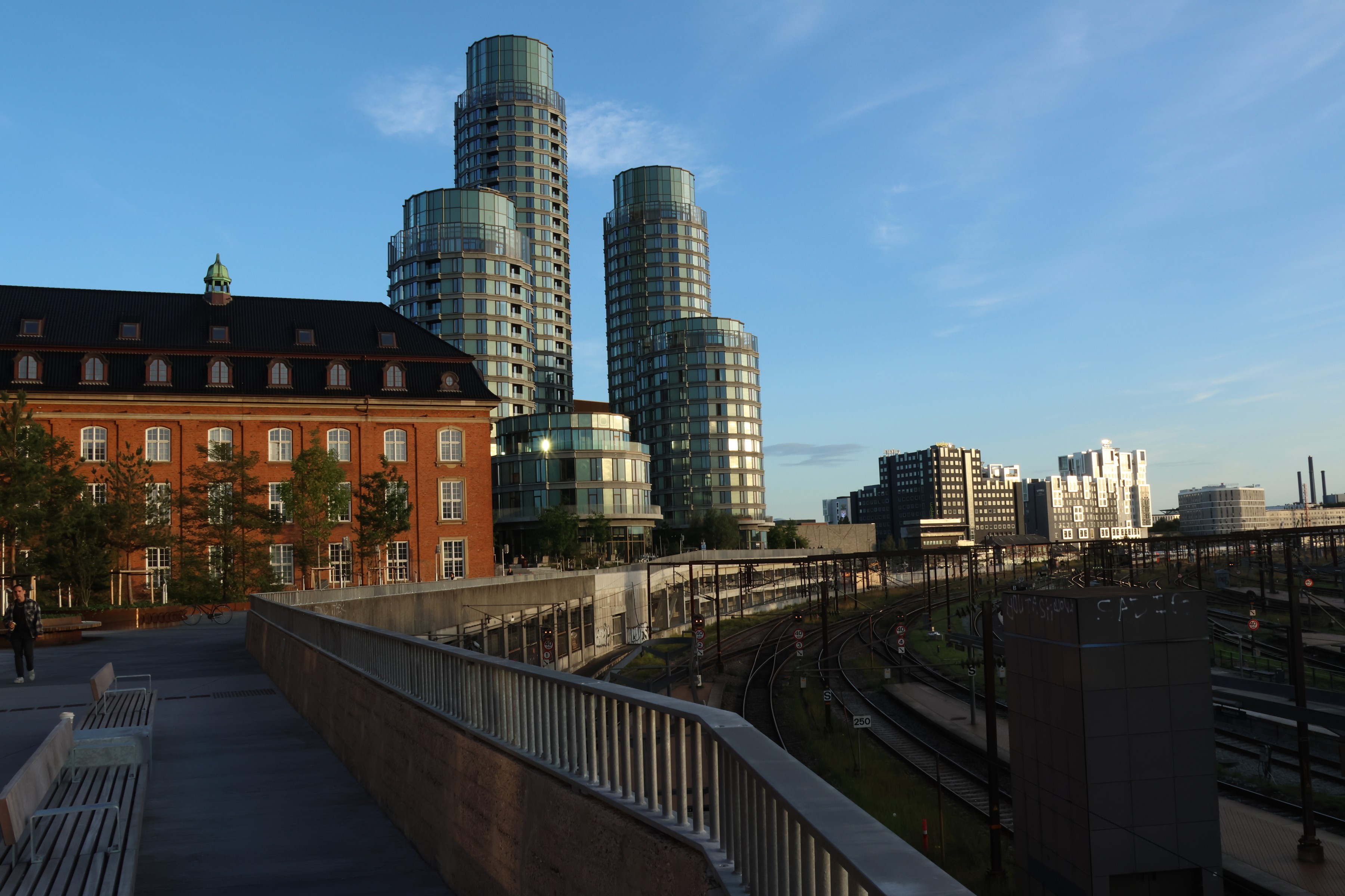 Round glass towers rising over the railway tracks in the Carlsberg district